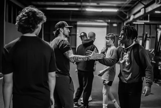 BCI coach connecting with young athlete